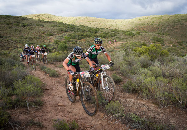 Aurelie Halbwachs (L) Yannick Lincoln (R) during stage 3 of the 2014 Absa Cape Epic Mountain Bike stage race held from Arabella Wines in Robertson to The Oaks Estate in Greyton, South Africa on the 26 March 2014. Photo: Sam Clark/Cape Epic/SPORTZPICS