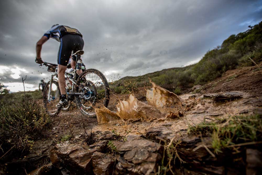 Riders make their way through the mud during stage 3 of the 2014 Absa Cape Epic Mountain Bike stage race held from Arabella Wines in Robertson to The Oaks Estate in Greyton, South Africa on the 26 March 2014. Photo: Karin Schermbrucker/Cape Epic/SPORTZPICS