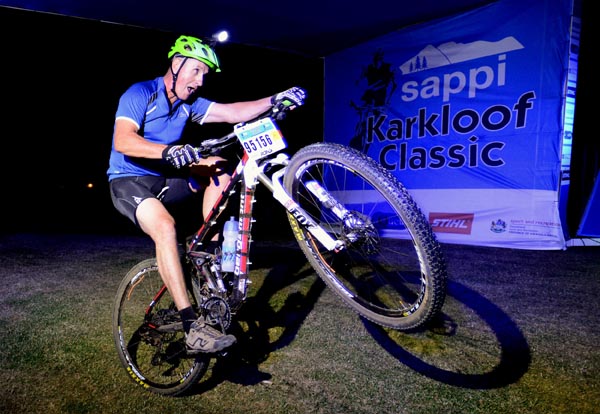 Piere Stephens pops a wheelie across the finish line as he clinches fourth place in Friday's Peri Night race, the opening event of the this weekend's Sappi Karkloof Classic MTB Festival. 