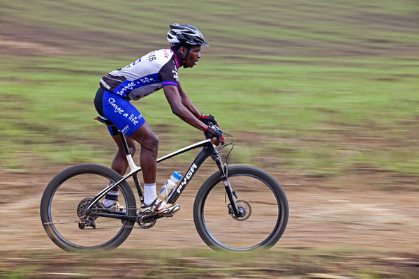 RMB Change a Life MTB Academy's Sthembiso Masango charges his way to a remarkable sixth place in the 2015 Sunday Tribune Jeep Hill2Hill mountain bike marathon, mixing it up with some of KZN's top professional riders along the way. Photo: Jon Ivins/Hill2Hill