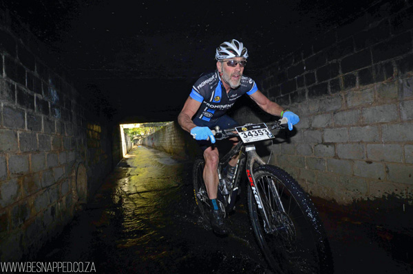 Fred Buter competing in the single speed category, rides through one of the storm water tunnels. Photo: BeSnapped