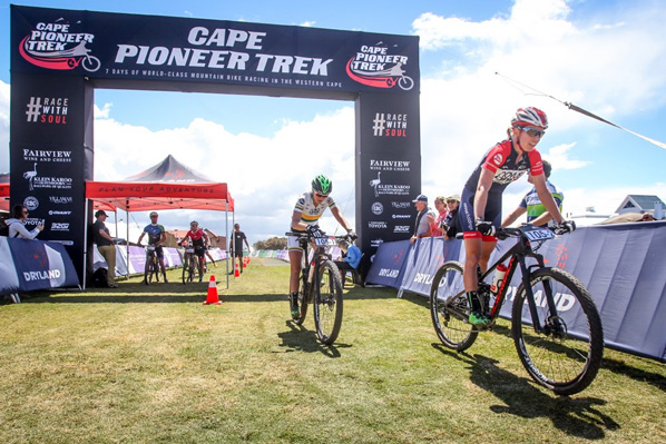Cherie Redeker leads Mariske Strauss across the finish line to win the women’s category of the prologue stage of the 2016 Cape Pioneer Trek international mountain bike stage race in Mossel Bay, South Africa on Sunday. Photo: www.oakpics.com