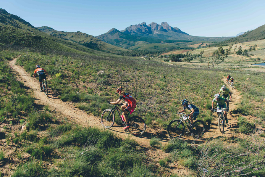 Jennie Stenerhag (Ascendis Health) hot on the heels of Ariane Lüthi (Team Spur) as they battle it out on a climbing singletrack. Photo: Haydeb Brown/www.zcmc.co.za