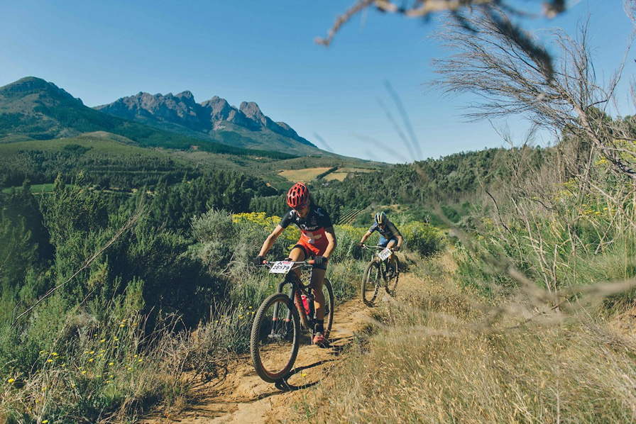 Jennie Stenerhag (Ascendis Health) hot on the heels of Ariane Lüthi (Team Spur) as they battle it out on a climbing singletrack. Photo: www.zcmc.co.za