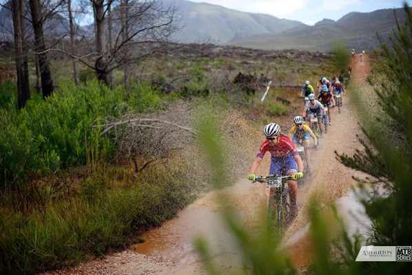 The Elite women hit a large puddle early on during Round 1 of the 2017 Ashburton Investments National Mountain Bike Series in Grabouw on Saturday. Photo: www.zcmc.co.za/Daniel Coetzee