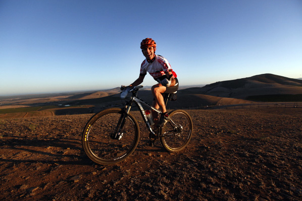 Cyclists compete during the prologue of the Absa Cape Epic mountain bike team stage race in Cape Town, South Africa, 25 March 2012. The Absa Cape Epic is the premier multi day stage race in the world and sees 1200 cyclists riding in pairs over 700km and climbing more than16000 meters, twice the high of Mount Everest over 8 days of racing.